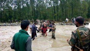 Army jawans rescue flood-stranded people across a stream in Jammu