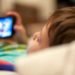 kid-using-mobile-stock-image